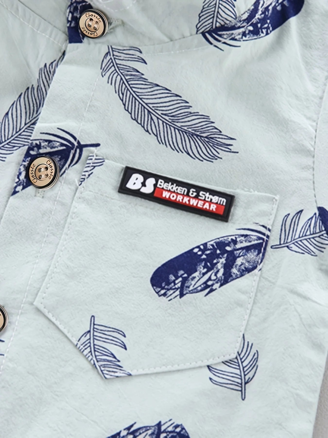 Set estivo da 2 pezzi con stampa di piume per bambini da 0 a 3 anni, camicia a maniche corte e pantaloncini con stampa casuale di cartoni animati alla moda